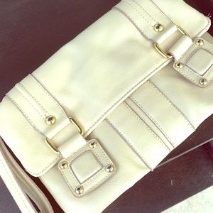 Daisy Fuentes Light camel colored leather clutch.